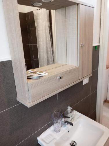 a bathroom with a sink and a mirror at Palazzo Lembo in Agnone