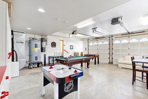 a room with a pool table and ping pong balls at Anchors Aweigh in Rockaway Beach