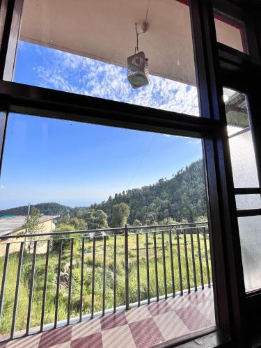 a view from the window of a house at The Hostel Stories Dharamkot - Mcleodganj in McLeod Ganj
