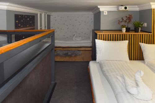 a small room with a bed and a small bedroom at Walk Inn Váci 78 in Budapest