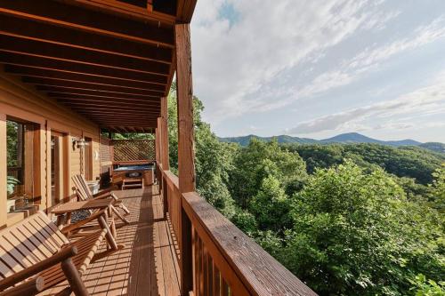 a porch with chairs and a view of the mountains at Glimpse of Heaven in Sevierville