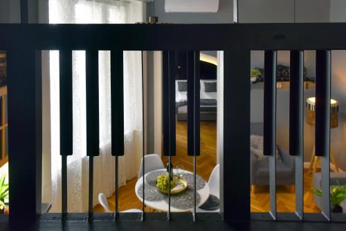 a black fence with a plate of food on a table at Walk Inn Váci 78 in Budapest