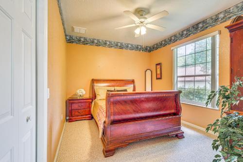 a bedroom with a bed and a dresser and a window at 1 Mi to Rainbow Springs State Park Home with Lanai! in Dunnellon