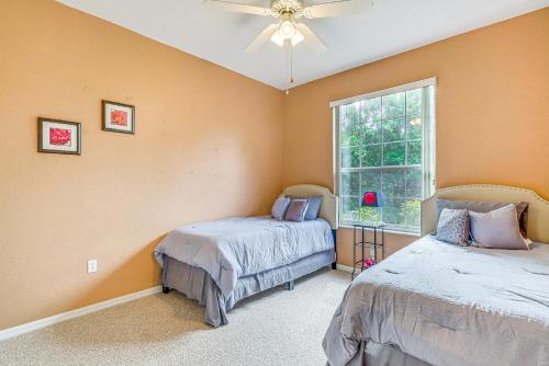 a bedroom with two beds and a window at 1 Mi to Rainbow Springs State Park Home with Lanai! in Dunnellon