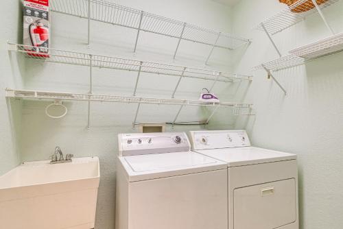 a laundry room with a washer and dryer at 1 Mi to Rainbow Springs State Park Home with Lanai! in Dunnellon