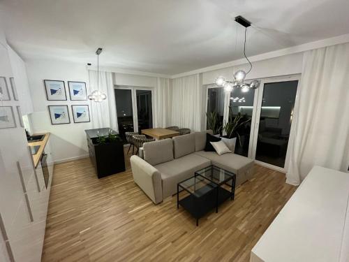 a living room with a couch and a table at Apartamenty Cieszyn in Cieszyn