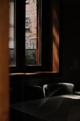 Ένα ή περισσότερα κρεβάτια σε δωμάτιο στο Faces & Places Boutique Hotel
