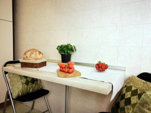 a counter with a table with some food on it at Casa Tonino in Pisticci