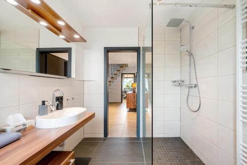 a bathroom with a sink and a shower at Eifel-resort in Waxweiler