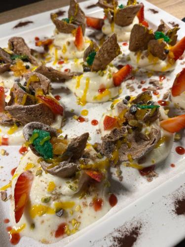 a white plate of food with food on it at B&B Del Centro e SPA in Partinico