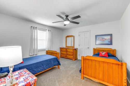 a bedroom with two beds and a ceiling fan at Watts Bar Lake Escape Private Boat Dock and Ramp! in Spring City