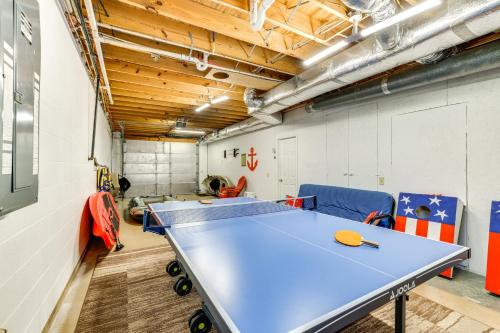 a ping pong room with a blue ping pong table at Watts Bar Lake Escape Private Boat Dock and Ramp! in Spring City