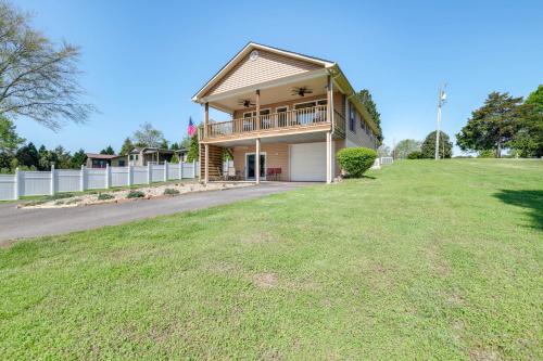 a house with a large yard in front of it at Watts Bar Lake Escape Private Boat Dock and Ramp! in Spring City