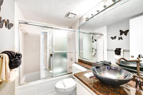 a bathroom with a sink and a shower at Waterfront Marco Island Condo Less Than quarter Mi to Beach! in Marco Island