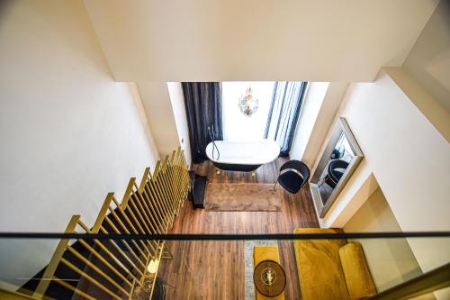 an overhead view of a stairway with a toilet in a room at Golden Rooms in Ioannina