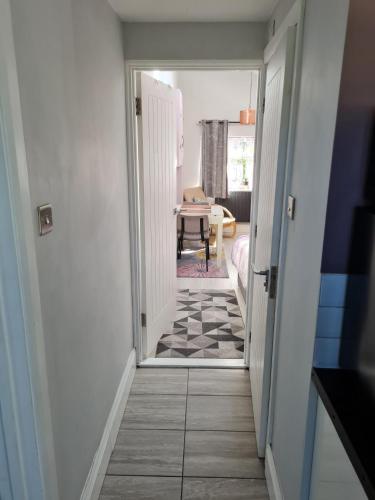 a hallway with a door leading to a room at 1 Bed Annex 2 mins from Harlow Mill train station in Harlow