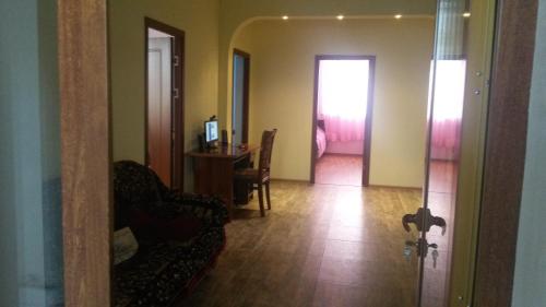 a living room with a couch and a table at Lusya B&B in Yeghegnadzor