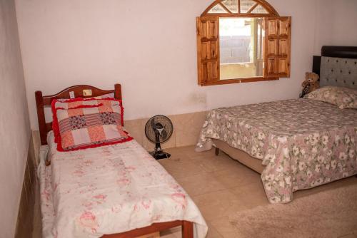 Voodi või voodid majutusasutuse Chacara com muito conforto em Alto Caparao MG toas