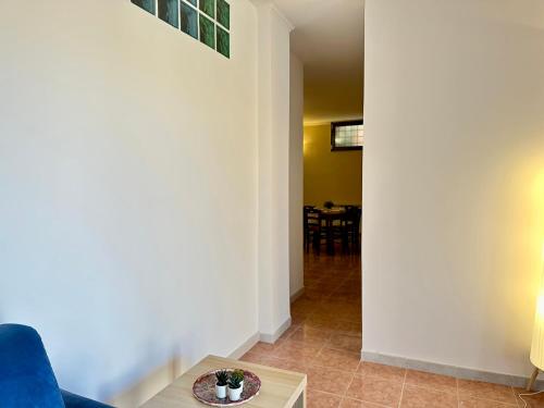 a living room with a couch and a table at A Casa di Anto - 90 mq con parcheggio interno Animal friendly in Infernetto