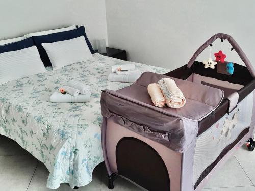 A bed or beds in a room at Terme Apartment Levico