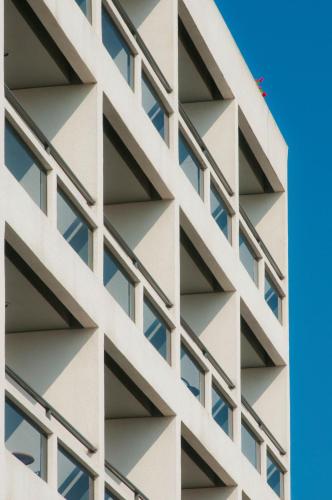 a facade of a building with windows at Alexandra Hotel&Apartments in Kos Town