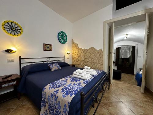 a bedroom with a bed with towels on it at Del Centro in Enna