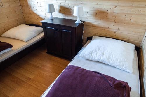 Postel nebo postele na pokoji v ubytování Lazur Apartamenty Domki