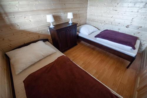 Postel nebo postele na pokoji v ubytování Lazur Apartamenty Domki