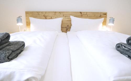 Ένα ή περισσότερα κρεβάτια σε δωμάτιο στο Strandloft Eins Norderney