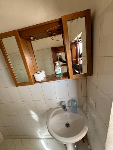a bathroom with a sink and a mirror at keur manga in Somone