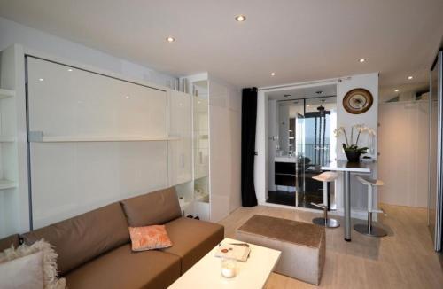 a living room with a couch and a table at FANTASTIC OCEAN VIEW in Biarritz