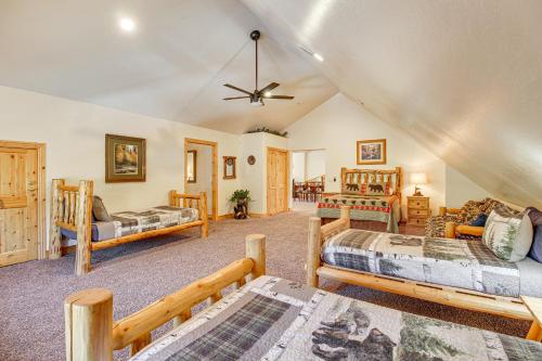 a room with four beds and a ceiling at Rustic Lakeside Cabin on 3 Acres w/ Nature Views! in Pinetop-Lakeside