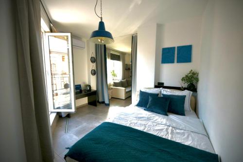 a bedroom with a bed and a large window at Cozy apartment Sunny Beach in Sunny Beach