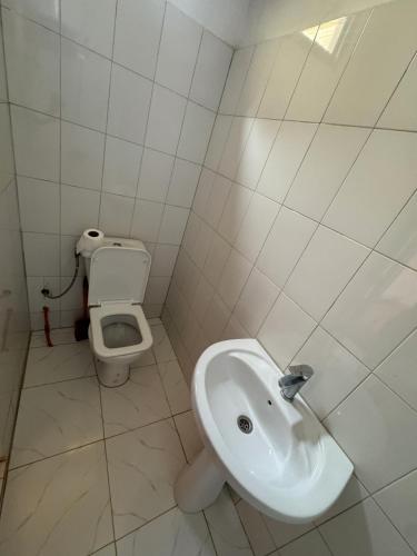 a bathroom with a sink and a toilet at keur manga in Somone