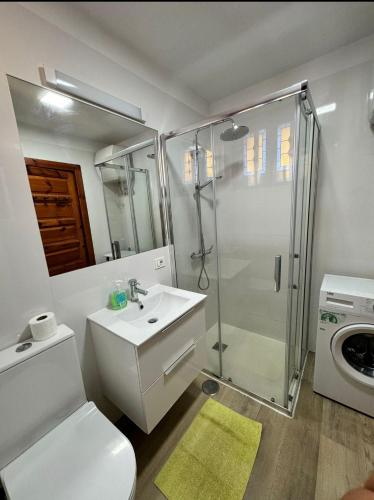 a bathroom with a toilet sink and a shower at il centro delle vacanze in Playa de las Americas