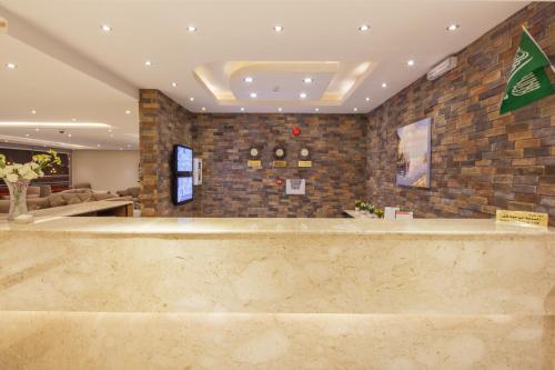 a lobby with a large counter in a building at Burj Alhayah Alfalah in Riyadh