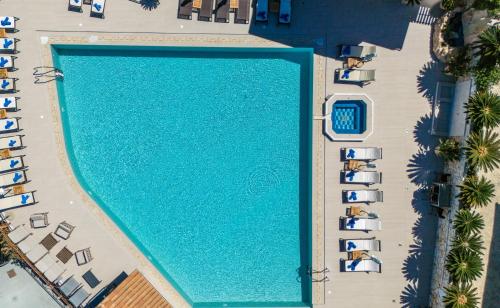 an overhead view of a swimming pool in a resort at Sea View Village in Vasilikos