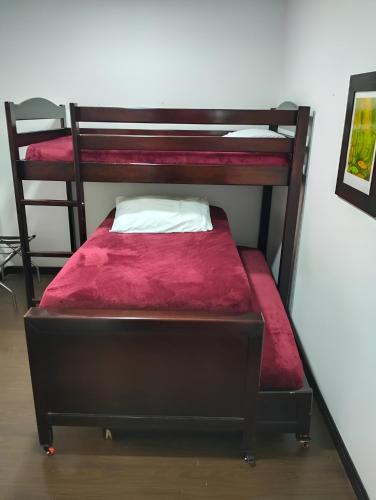 a couple of bunk beds in a room at HBCF Hotel Boutique Casa Farallones de Santiago de Cali in Cali