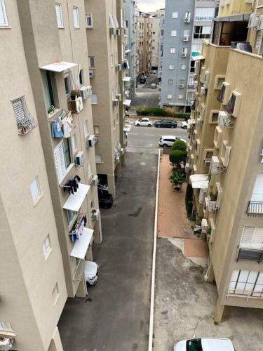 an aerial view of an alley between two buildings at Bat Yam Penthouse Sea View in Bat Yam