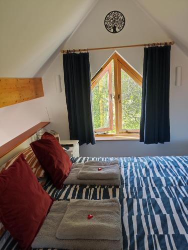 a bedroom with a bed and a window at The Studio, Upper House Farm, Crickhowell with Double Garage and Free Parking in Crickhowell