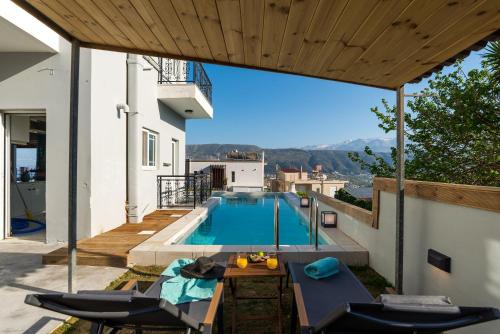 a swimming pool on the roof of a house at SeaviewHeaven - Private pool - Overlooking Chania in Chania Town