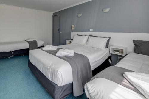 Ένα ή περισσότερα κρεβάτια σε δωμάτιο στο Central Motel Port Fairy