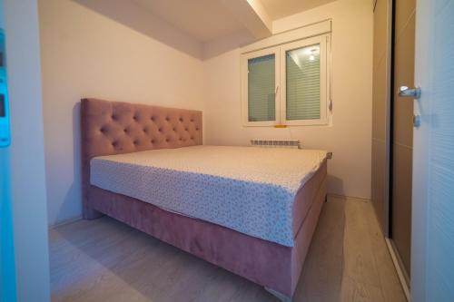Una cama o camas en una habitación de Apartman BOJANA