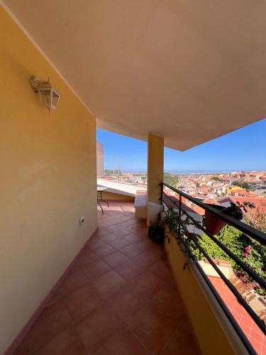 a balcony with a view of a city at Villetta panoramica con giardino in Ossi