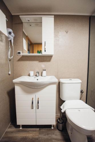 a bathroom with a sink and a toilet at Urban Studio Apartments in Strumica