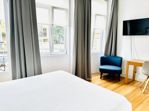 En eller flere senge i et værelse på 8 VILLAS Hotel