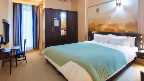 Krevet ili kreveti u jedinici u okviru objekta SCN Pet-friendly Hotel โรงแรมรับสัตว์เลี้ยง