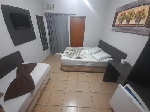 Katil atau katil-katil dalam bilik di Maranata Hotel