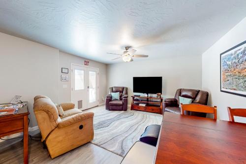 a living room filled with furniture and a flat screen tv at Grandma's Southern Comfort Vacation Rental in Hurricane