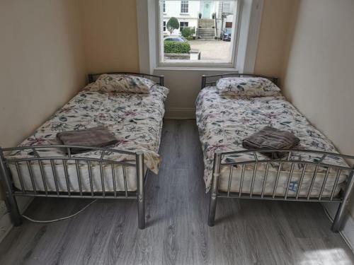 Ένα ή περισσότερα κρεβάτια σε δωμάτιο στο DUBLIN PALM